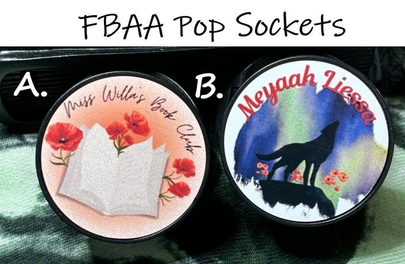 May include: Two round pop sockets. One features a book and red poppies with the text "Miss Willa's Book Club". The other has a wolf silhouette, flowers, and the text "Meyaah Liessa" against a watercolor background.