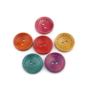 May include: A collection of six round, colorful wooden buttons. Each button has two holes and a decorative stitched border. The buttons are in shades of orange, red, yellow, teal, purple, and pink.