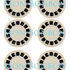 May include: Six vintage View-Master reels with a cream-colored frame and dark blue images. The text "MON BON BON" is printed in light blue across the reels. Each reel has a series of small square windows containing the images.