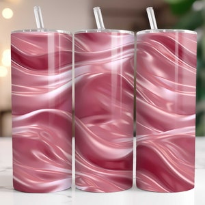 May include: Three stainless steel tumblers with a pink and white swirl design. The tumblers have lids and straws.