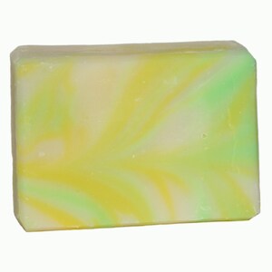May include: A bar of soap with a swirl pattern in shades of yellow, green, and white.