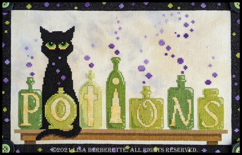 May include: Cross-stitch design featuring a black cat with green eyes sitting in front of green potion bottles. The word "POTIONS" is spelled out in large letters. Purple bubbles float above the bottles. The design is framed in black.