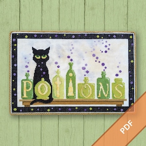 May include: Cross-stitch design featuring a black cat with green eyes, sitting in front of green potion bottles. The word "POTIONS" is stitched in green letters. Purple bubbles emanate from the bottles. The design is framed with a black and purple border.