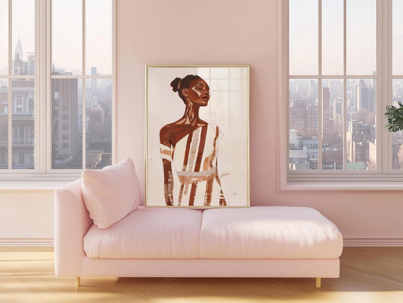 May include: A framed art print featuring a portrait of a person in a white and brown striped garment. The artwork is displayed on a pink chaise lounge in a room with large windows overlooking a cityscape. The frame is gold.
