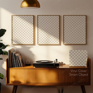May include: A mid-century modern style living room setup with three gold-framed art prints, a wooden record cabinet, and a record player. A large potted plant and a gold pendant light add to the decor. The text "Vinyl Cover Smart Object" is visible.