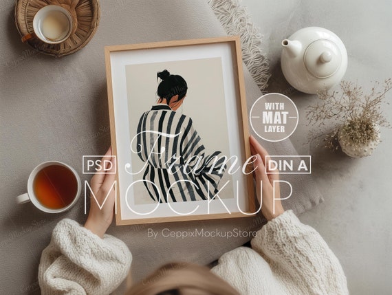 A4 A3 Frame Mockup, Woman Holding Poster, Wood Interior Scene (PSD)