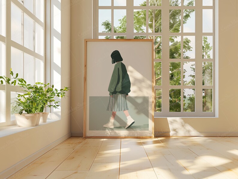 May include: A framed illustration of a person wearing a green jacket and a black and white skirt, walking towards the right side of the image. The person is standing on a light green background. The frame is wooden and has a light brown color.