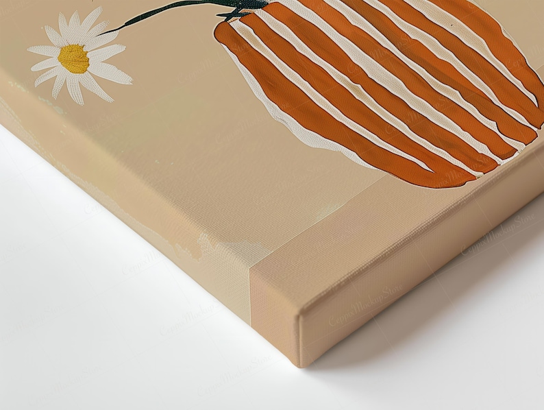 May include: A canvas print depicting a daisy and a vase with orange and white stripes. The artwork has a neutral colour palette with a beige background and a white border.