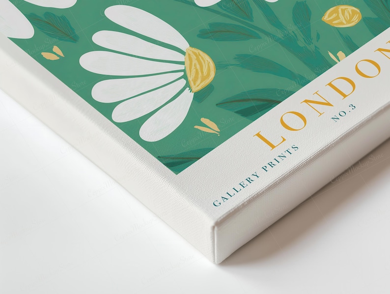 May include: A canvas print with a floral pattern of white daisy-like flowers and green leaves on a teal backdrop. The print includes the text "LONDON NO. 3 GALLERY PRINTS" in gold lettering.