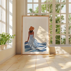 May include: A framed illustration of a person wearing a straw hat and a blue and white striped dress, sitting on a blue and white striped wave pattern.