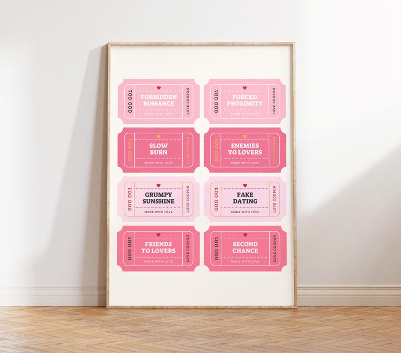 May include: A framed print featuring eight pink love coupons with phrases like "Forbidden Romance" and "Fake Dating." Each coupon has a heart and the words "Made with Love."