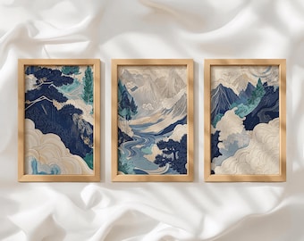 May include: Three rectangular wall art prints in light wood frames, each featuring a landscape illustration in shades of navy blue, teal, and cream. The artwork depicts stylized mountains, winding rivers, pine trees, and swirling cloud patterns.