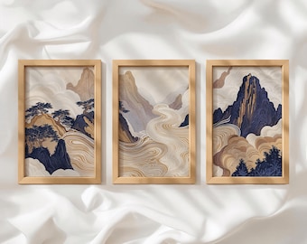 Peut inclure: Trois cadres muraux rectangulaires en bois clair contenant des illustrations de paysages avec des montagnes stylisées, des cours d'eau et des arbres bleu foncé, le tout dans des tons beige, ocre et bleu profond avec des motifs de nuages.