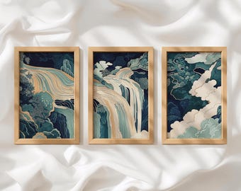 May include: Three rectangular wall art prints in light wood frames. Each print features a stylized landscape with flowing water, dark blue foliage, and cream-colored clouds. The artwork uses a palette of deep blue, teal, and soft gold lines.