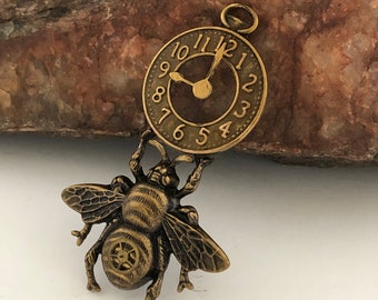 Unique Steampunk Bee Hanging From Clock, Custom Pendant, Metal Bonded Together. A Real Pocket Watch gear on Bee