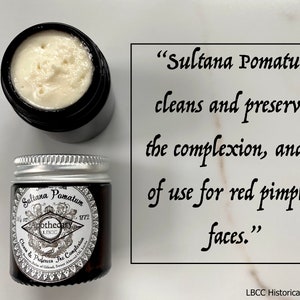May include: Two glass jars of Sultana Pomatum face cream, a historical apothecary product. The jars are labeled "Sultana Pomatum Apothecary 1772 Clean & Preserves The Complexion". The text "Sultana Pomatum cleans and preserves the complexion, and is of use for red pimpled faces." is written in cursive on a white background.