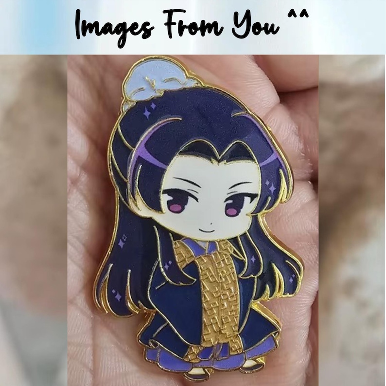 May include: A gold-colored enamel pin featuring a chibi-style character with long dark blue hair and purple eyes. The character wears a dark blue robe with gold accents and a small hat. The text "Images From You ^^" is at the top.