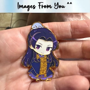 May include: A gold-colored enamel pin featuring a chibi-style character with long purple hair and a blue outfit. The character has a smiling expression and is wearing a gold-colored garment. The text "Images From You" is at the top.