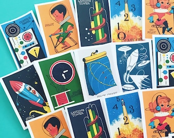 May include: A set of 10 colorful cards with illustrations of a space-themed game. The cards feature images of a rocket, a space ship, a pilot, a landing tower, a control panel, and a blast off sequence. The cards are numbered 1 through 5.