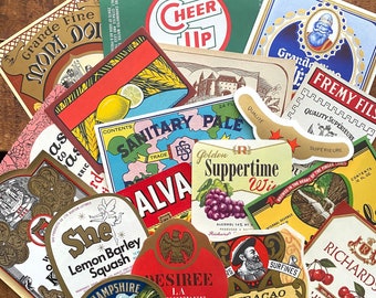 May include: A collection of vintage bottle labels with various designs and text. The labels feature a variety of colors, including red, blue, green, and gold. Some of the labels have images of animals, such as a butterfly and a bird. The labels also have text, such as "Grande Fine Mont DOI", "Cheer Up", "Sanitary Pale", "Golden Suppertime Wine", "Alva", "Desiree", "Curacao Triple Sec", "Fremy Fils", and "Richards".