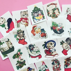 May include: A set of 16 vintage Christmas stickers featuring kittens in various holiday scenes. The stickers are printed on white paper and feature a variety of festive designs, including kittens in stockings, kittens with Santa Claus, kittens in a sleigh, and kittens under a Christmas tree. The stickers are perfect for adding a touch of holiday cheer to your gifts, cards, or scrapbook.