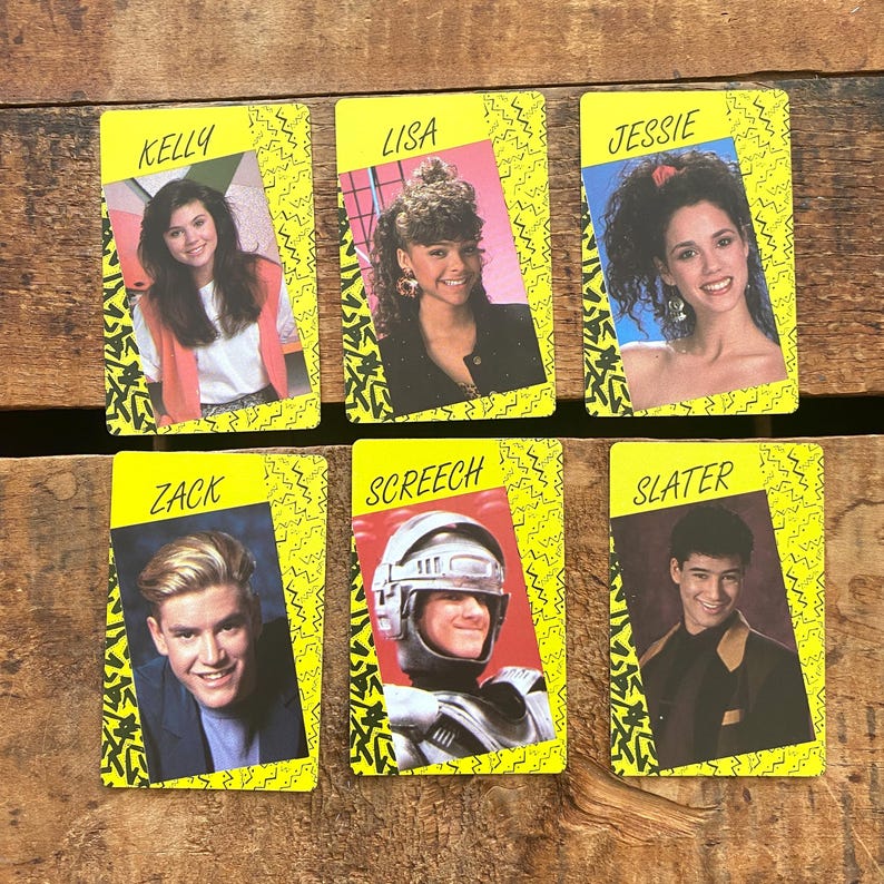 May include: Six vintage trading cards featuring images of actors. Each card has a yellow background with a black zig-zag pattern. The cards display the names "Kelly", "Lisa", "Jessie", "Zack", "Screech", and "Slater" at the top.