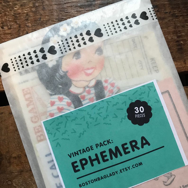 May include: A vintage pack of 30 ephemera pieces. The pack includes a variety of images, including a girl with a red and white striped shirt and a heart-shaped design. The pack is labeled "Vintage Pack: Ephemera" and "BostonBagLady.Etsy.com".