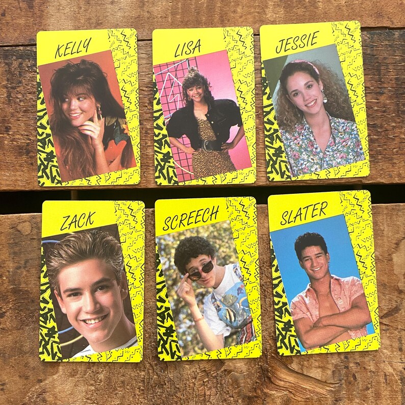 May include: Six vintage trading cards featuring characters named Kelly, Lisa, Jessie, Zack, Screech, and Slater. Each card has a yellow border with a black and white zigzag design. The cards display headshots of the characters.