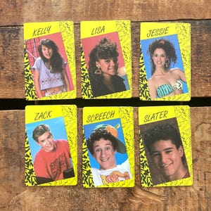 May include: Six vintage trading cards featuring cast members from a television show. Each card has a yellow border with a black zig-zag design. The cards display the names Kelly, Lisa, Jessie, Zack, Screech, and Slater.