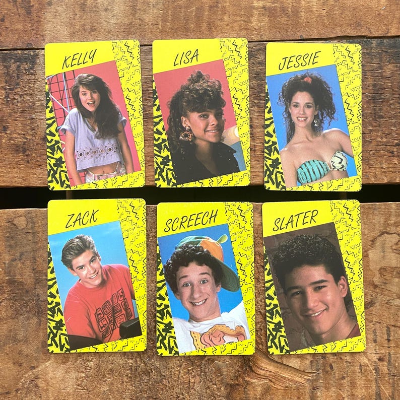 May include: Six vintage trading cards featuring cast members from a television show. Each card has a yellow border with a black zig-zag design. The cards display the names Kelly, Lisa, Jessie, Zack, Screech, and Slater.