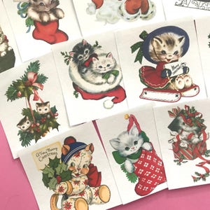 May include: A set of 10 vintage Christmas stickers featuring adorable kittens in various holiday scenes. The stickers feature kittens wearing Santa hats, holding holly, and sitting in stockings. The stickers are perfect for adding a touch of whimsy to your holiday cards, gifts, or scrapbook pages.
