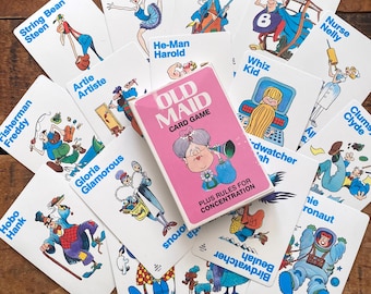 May include: A vintage Old Maid card game with a pink box and illustrated cards. The cards feature cartoon characters with names like "Hobo Hank," "Nurse Nelly," and "Super Blob." The game is designed for concentration.