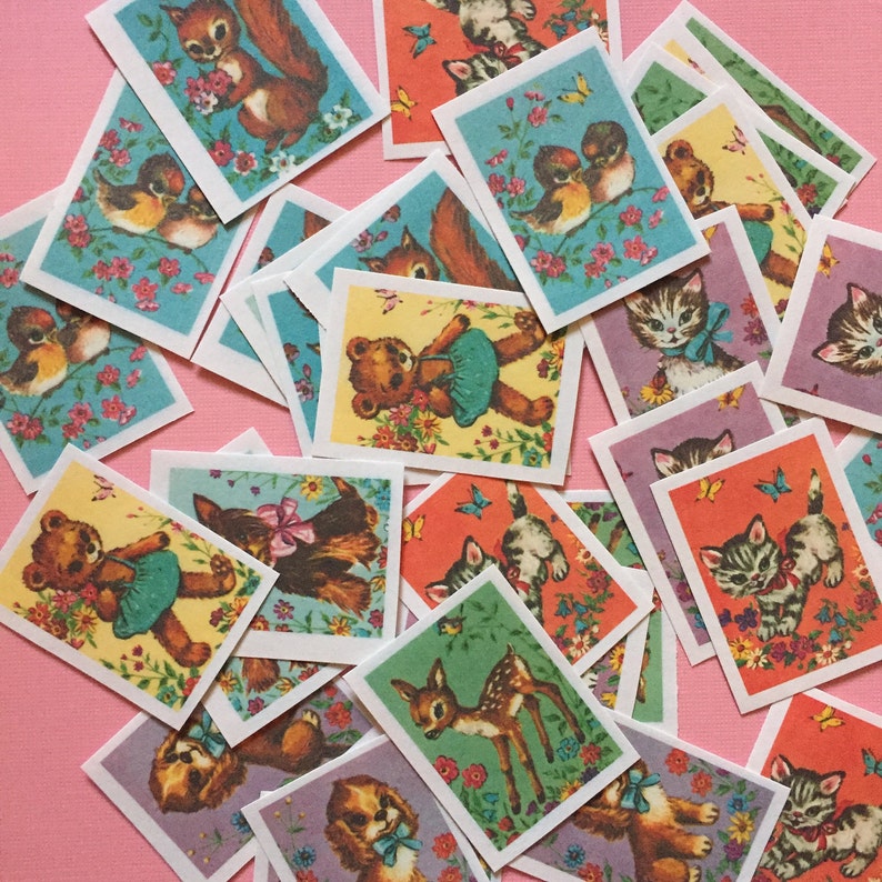 May include: A collection of colorful vintage animal stickers with a variety of animals including a squirrel, a deer, a cat, a bear, a bird, and a dog. The stickers are on a pink background.