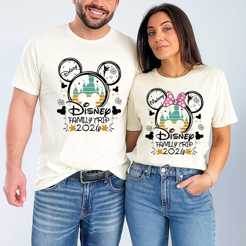 A man and a woman are standing next to each other, both wearing Disney-themed t-shirts.