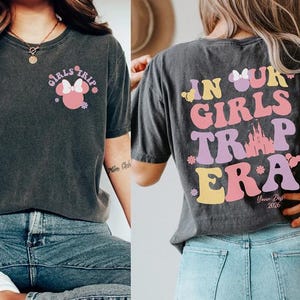 The image is a collage of two photos featuring a woman wearing a black t-shirt with a Minnie Mouse design and text on the back, as well as a woman wearing a gray t-shirt with text and a castle graphic.