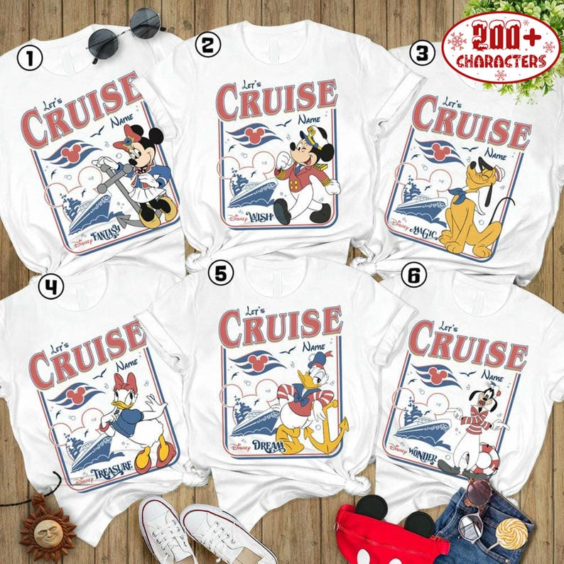 six white t-shirts with Disney-themed designs, including characters like Mickey Mouse, Donald Duck, and Goofy, along with the text "Let's Cruise" and "Disney Wonder". The t-shirts are arranged in a grid, with each row containing three shirts. The t-shirts are displayed on a wooden surface, and there are some sunglasses and a pair of sneakers visible in the image.