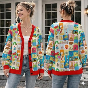May include: A long-sleeve button-down cardigan featuring a vibrant, multi-coloured grid pattern of various illustrated storybook characters. The garment has a solid red V-neck collar, red sleeve cuffs, and a red hemline, worn over a white top and blue jeans.