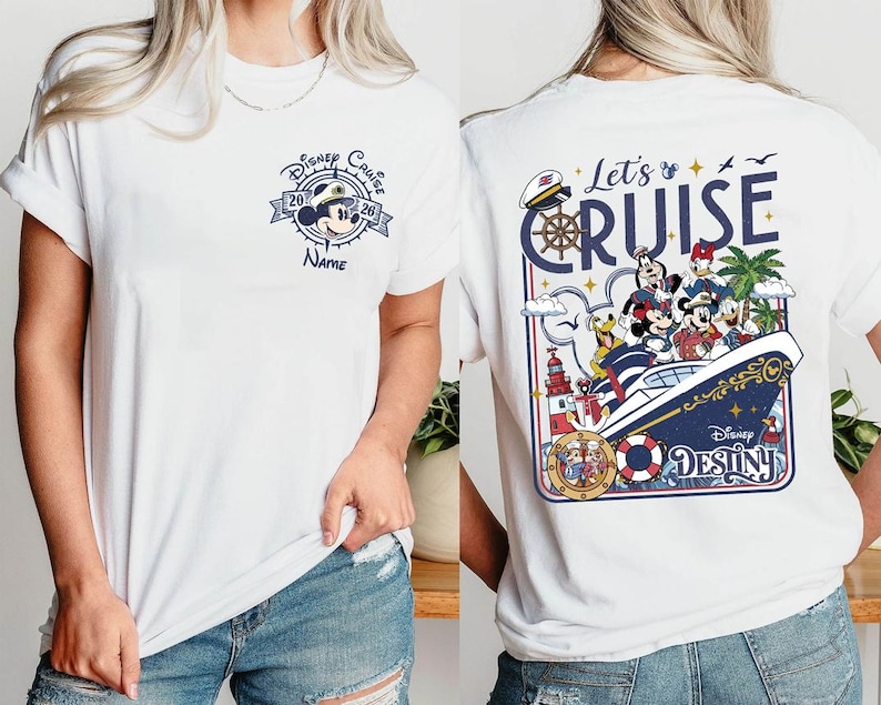 A white t-shirt with a Disney Cruise-themed design on the back, featuring characters such as Minnie Mouse, Mickey Mouse, Donald Duck, and Donald Duck's ship.