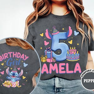 a girl wearing a birthday shirt with the number five on it
