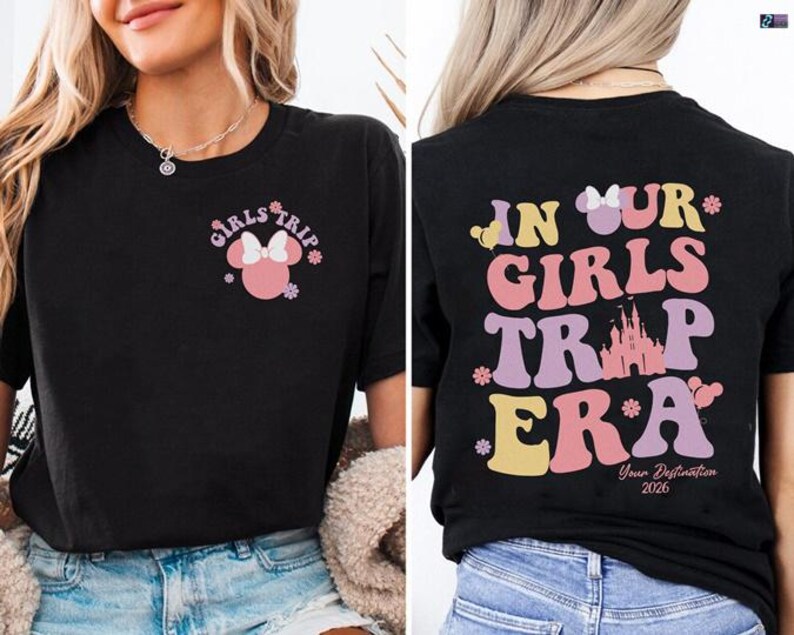 a woman wearing a black t-shirt with a graphic design on the back. The design includes text and a Minnie Mouse character, and it appears to be a promotional or merchandise item related to a girls' trip or a Disney-themed event.