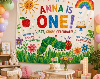May include: A fabric backdrop featuring The Very Hungry Caterpillar theme with the text ANNA IS ONE, EAT, GROW, CELEBRATE, WELCOME TO ANNA'S LITTLE GARDEN, and TINY CATERPILLAR, BIG ADVENTURES, decorated with a sun, rainbow, apple, and cake.