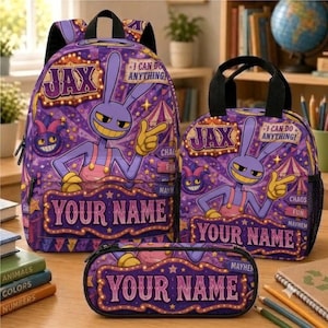 May include: A purple backpack, lunch bag, and pencil case set featuring a cartoon rabbit character named Jax, circus-themed graphics, and the text "JAX", "I CAN DO ANYTHING", and "YOUR NAME" printed on each item with yellow and orange accents.