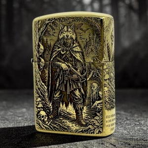 May include: A gold-colored metal lighter with an engraved design. The design features a wolf-like figure in a cloak holding a crossbow, surrounded by trees, a castle, and other fantasy elements. The lighter has a rectangular shape.
