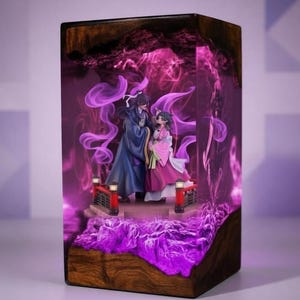 May include: A wooden block with a detailed diorama inside. The diorama features two figures on a bridge, surrounded by purple smoke and lighting. The base of the block is a dark wood, and the interior has a glowing purple effect.