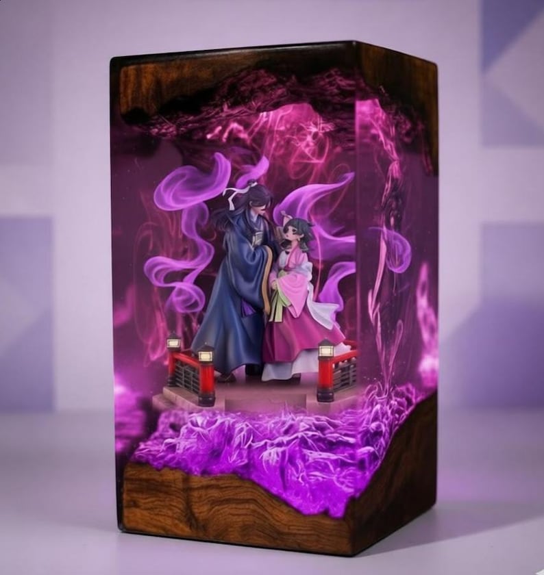 May include: A wooden block with a detailed diorama inside. The diorama features two figures on a bridge, surrounded by purple smoke and lighting. The base of the block is a dark wood, and the interior has a glowing purple effect.