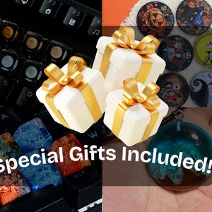 May include: An assortment of gifts, including white gift boxes with gold ribbons, decorative buttons with Halloween themes, and a blue and brown pendant. The image also shows a keyboard with custom keycaps, and the text "Special Gifts Included!"