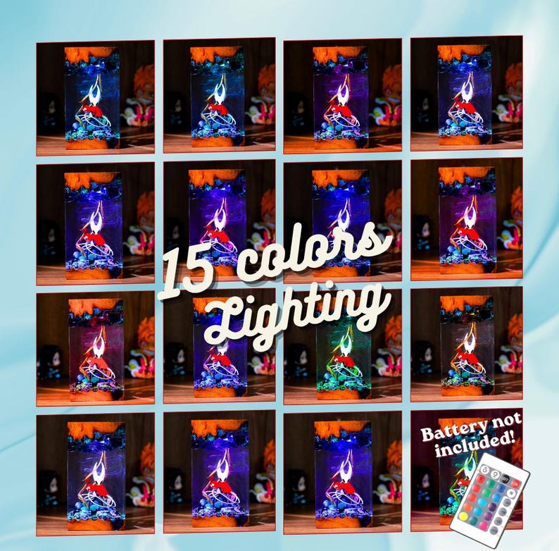 May include: A collection of 15 color-changing LED lamps. Each lamp features a red figure with blue and green accents, set within a clear rectangular casing. The lamps have an orange top and sit on a wooden surface. The image includes the text "15 colors Lighting".