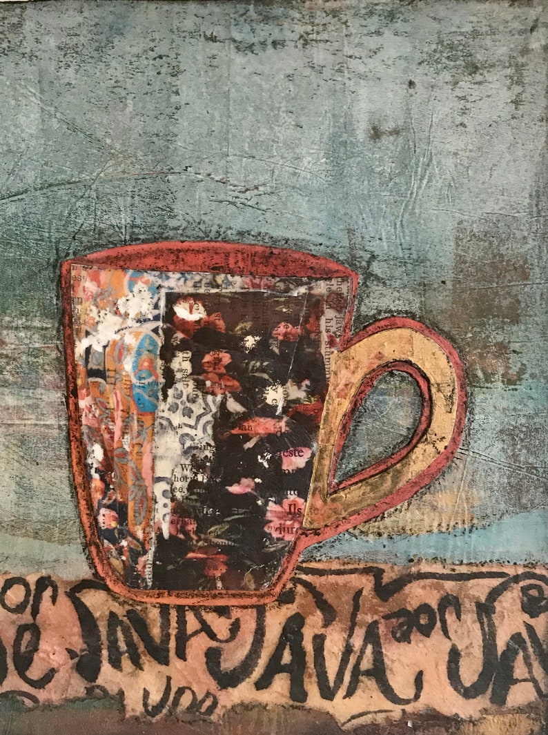 May include: A red and yellow coffee mug with a floral pattern and the words "The Java" written on a brown surface.