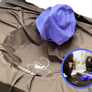 May include: A brown beard hair catcher with the text "Beard Hero" and a white logo. A blue shower cap is on top of the catcher. The image includes a circular inset showing a person using the product.
