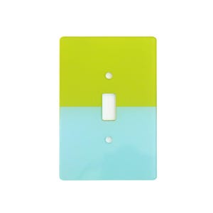 May include: A rectangular light switch wall plate featuring a two-tone color block design. The top half is a vibrant lime green, while the bottom half is a soft sky blue. It includes a central rectangular cutout for a toggle switch and two holes.